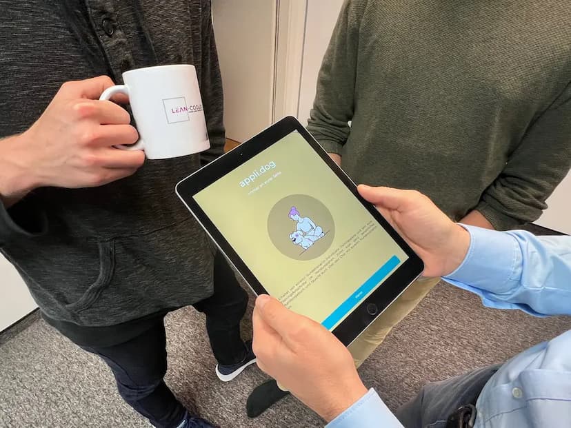 A person holding a Tablet with the applidog app open