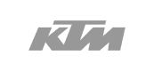Logo des Unternehmens KTM in grau auf blauem Hintergrund.